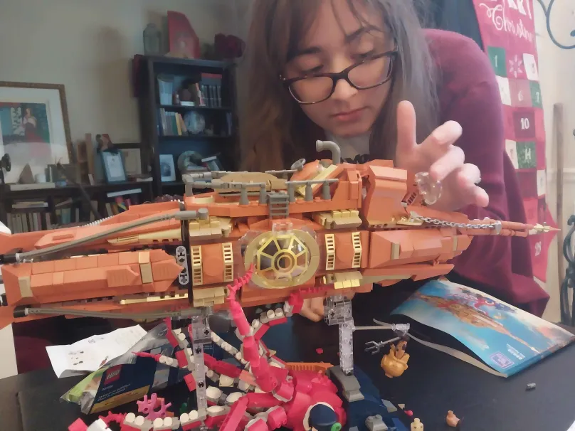 Lego submarine Ship with a Kraken underneath.